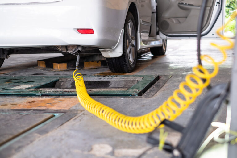 Close-up of exhaust testing process.