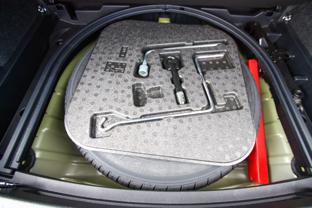 Standard tire change set in the trunk of a car