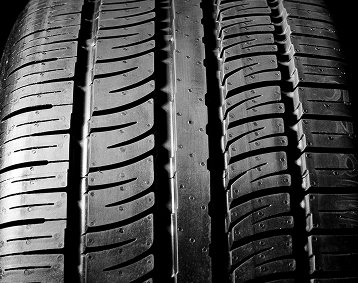Closeup of tire treads on a brand new tire.