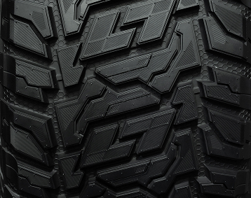 Closeup of tire treads on a brand new, all-terrain tire.