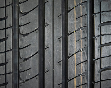 Closeup of tire treads on a brand new tire.