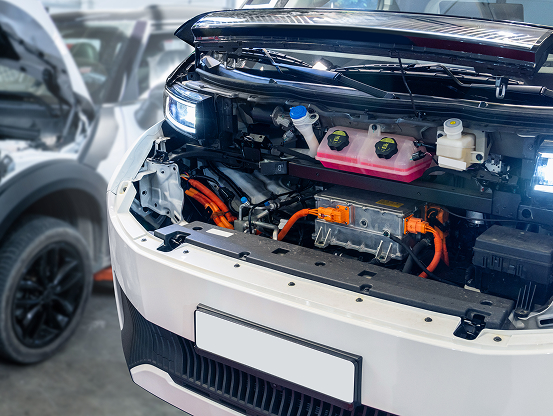 Under the hood of a white commercial vehicle during fleet repair services at Telle Tire.