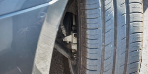 The front suspension system on the tire and part of the independent front suspension components, including shock absorber.