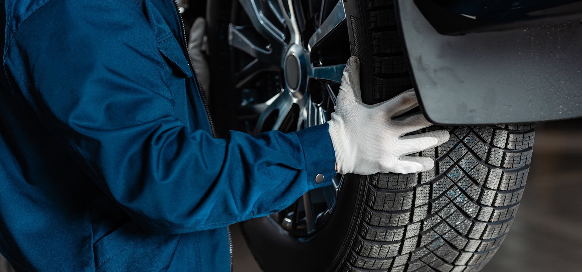 A Telle Tire mechanic installing a new tire to a vehicle for a customer at the shop.